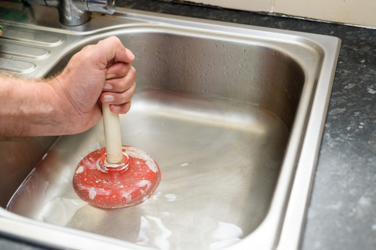 can you clear a clogged kitchen sink
